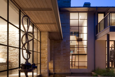 Design ideas for a beige modern two floor house exterior in Dallas.