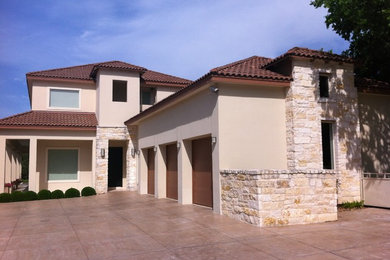 Inspiration for a large mediterranean beige one-story stone exterior home remodel in Austin