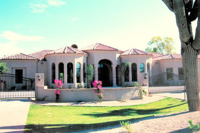 Tuscan house exterior photo in Phoenix with a tile roof