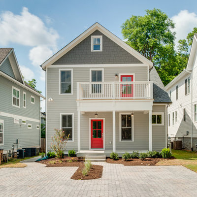 Inspiration for a mid-sized transitional gray three-story concrete fiberboard exterior home remodel in Nashville with a shingle roof