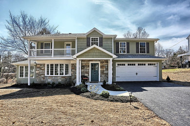 Green vinyl house exterior idea in Other with a shingle roof