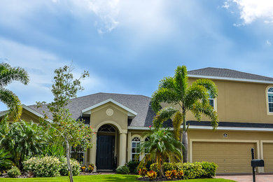 Example of a classic two-story exterior home design in Orlando