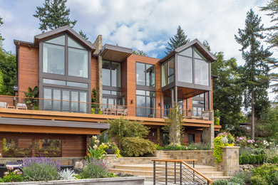 Inspiration for a large contemporary three-story mixed siding house exterior remodel in Seattle