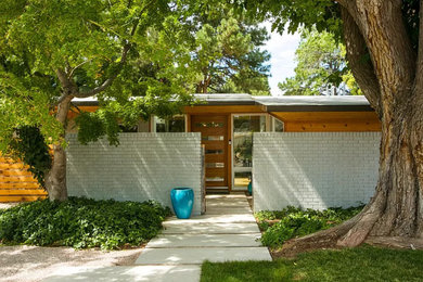 Example of a 1950s exterior home design in Albuquerque
