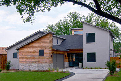 Contemporary gray stucco exterior home idea in Dallas