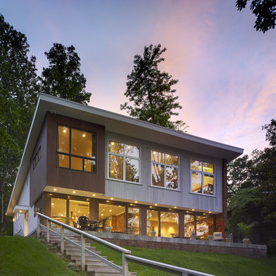Trendy two-story exterior home photo in DC Metro with a shed roof