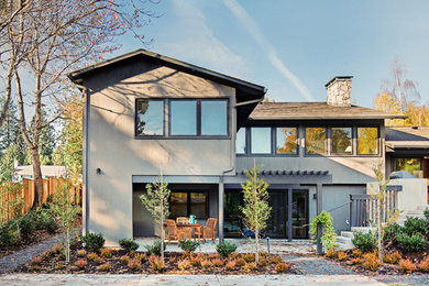 Contemporary gray split-level wood gable roof idea in Portland