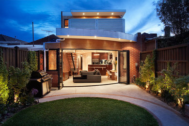 This is an example of a contemporary two floor brick house exterior in Melbourne.