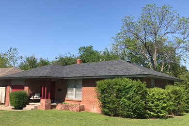 Example of a house exterior design in Oklahoma City with a hip roof and a shingle roof