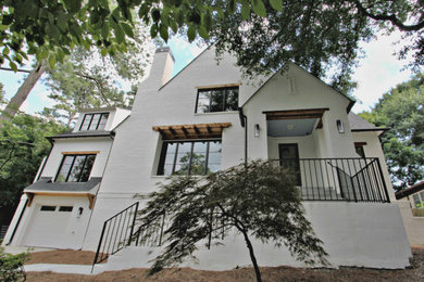 Example of a transitional white painted brick house exterior design in Atlanta