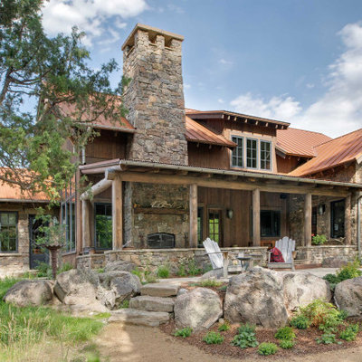 Mountain style brown one-story mixed siding exterior home photo in Other with a metal roof