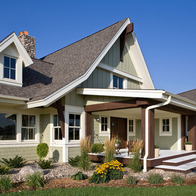 Cottage wood exterior home idea in Minneapolis