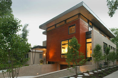 Inspiration for a contemporary red metal exterior home remodel in Denver