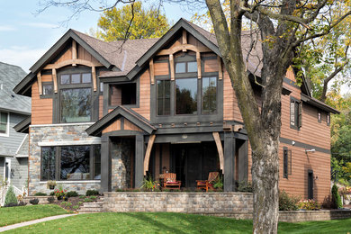 Rustic brown two-story exterior home idea in Minneapolis