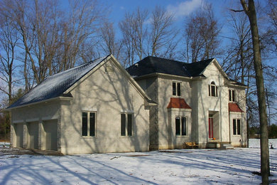 Inspiration for a mid-sized transitional beige two-story brick exterior home remodel in Toronto