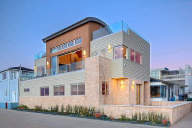 Large modern beige two-story mixed siding house exterior idea in San Diego