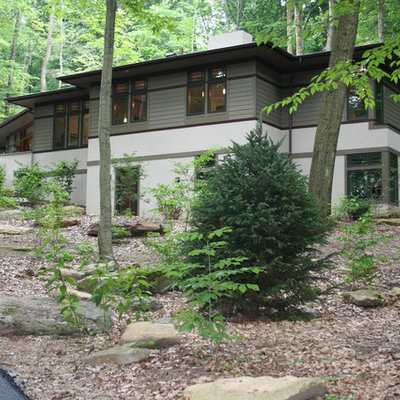 Large arts and crafts multicolored two-story mixed siding exterior home photo in Philadelphia with a metal roof