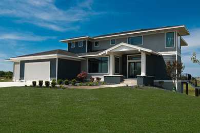 Minimalist two-story concrete fiberboard exterior home photo in Grand Rapids