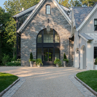 Example of a large transitional gray three-story stone exterior home design in New York with a shingle roof