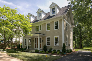 Inspiration for a large traditional house exterior in Jackson with three floors.