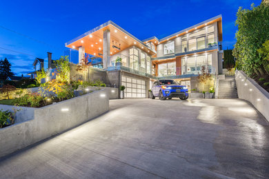 Inspiration for a modern gray three-story house exterior remodel in Vancouver