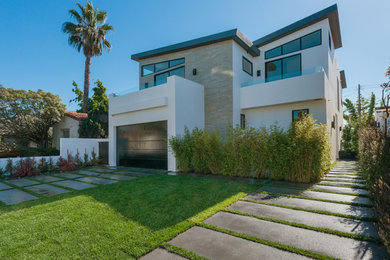 Inspiration for a large contemporary white two-story mixed siding flat roof remodel in Los Angeles