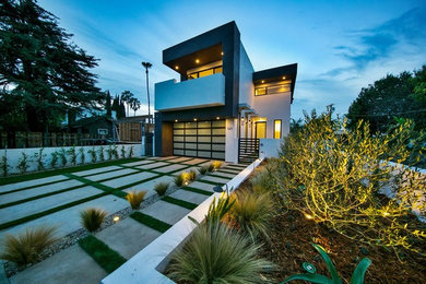 Contemporary gray two-story flat roof idea in Los Angeles