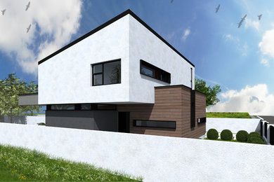 Esempio della facciata di una casa grigia moderna a due piani di medie dimensioni con rivestimento in legno e tetto a padiglione