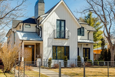 Cottage white two-story house exterior idea in Denver