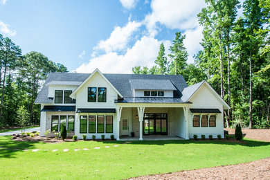 Large country white two-story mixed siding exterior home idea in Atlanta with a shingle roof