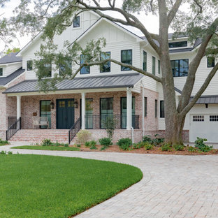 Inspiration for a large farmhouse white two-story mixed siding exterior home remodel in Houston with a shingle roof
