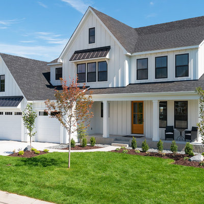 Large country white two-story wood exterior home idea in Minneapolis with a shingle roof