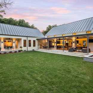 Example of a farmhouse white one-story wood exterior home design in Dallas