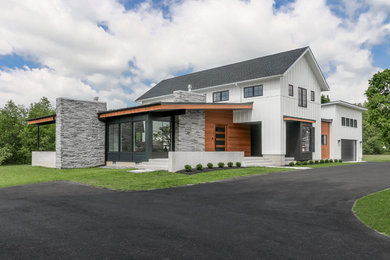 Mid-sized farmhouse white two-story mixed siding house exterior photo in Philadelphia with a shed roof and a shingle roof