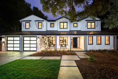 Inspiration for a farmhouse white two-story mixed siding exterior home remodel in San Francisco