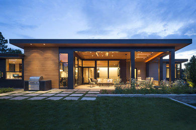 Inspiration for a mid-sized modern black one-story mixed siding exterior home remodel in Denver with a metal roof