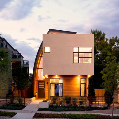 Inspiration for a mid-sized contemporary beige two-story wood exterior home remodel in Denver