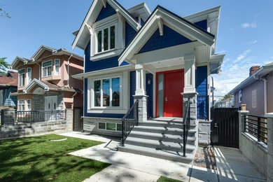 Mid-sized craftsman blue two-story wood exterior home idea in Vancouver with a shingle roof