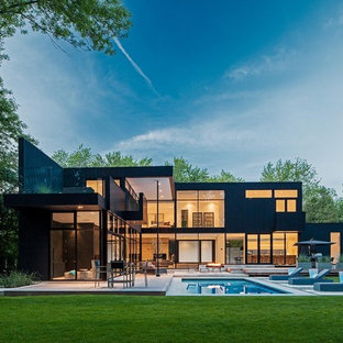 Large minimalist black two-story exterior home photo in Toronto