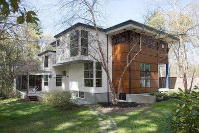 Foto de fachada de casa blanca contemporánea grande de dos plantas con revestimientos combinados y tejado plano