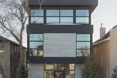 Mid-sized minimalist multicolored three-story mixed siding house exterior photo
