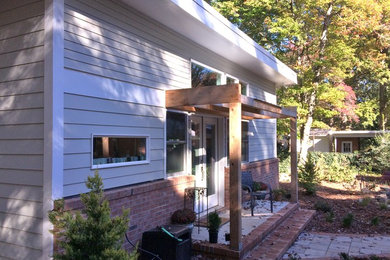 Example of a minimalist exterior home design in Raleigh