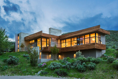 Contemporary two-story mixed siding flat roof idea in Denver