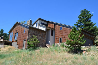 Example of a large minimalist multicolored two-story mixed siding exterior home design in Denver with a shingle roof