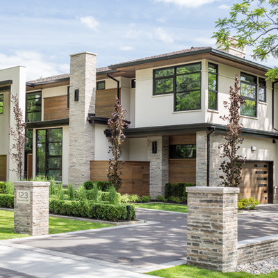Inspiration for a large contemporary brown two-story wood exterior home remodel in Toronto
