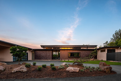 Diseño de fachada de casa minimalista de una planta con tejado plano