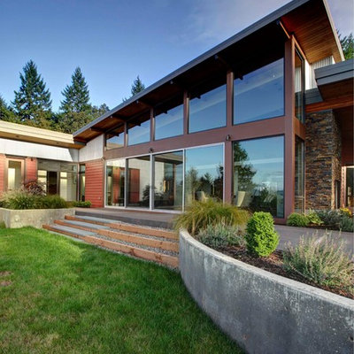Trendy red one-story metal exterior home photo in Portland
