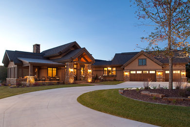 Inspiration for a huge rustic beige two-story mixed siding house exterior remodel in Minneapolis