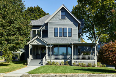 Mid-sized contemporary gray three-story wood house exterior idea in Boston with a shingle roof