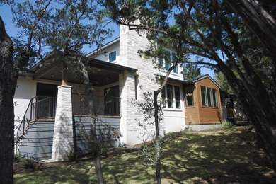 Inspiration for a craftsman white one-story stone exterior home remodel in Austin